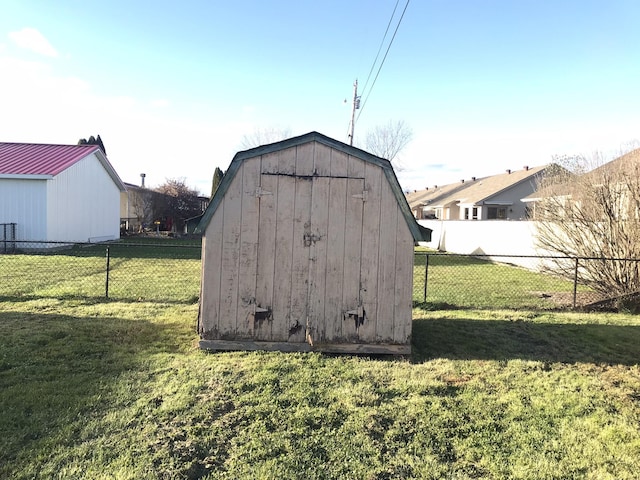 view of outbuilding featuring a yard