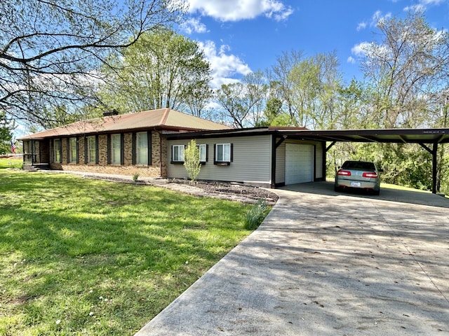 single story home with a garage, a front yard, an attached carport, and concrete driveway