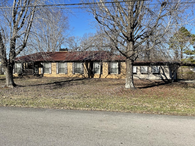 ranch-style house with an attached carport