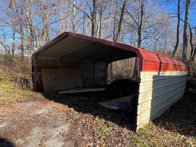 view of outbuilding with a carport