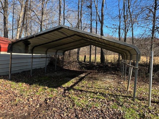 view of parking / parking lot with a carport