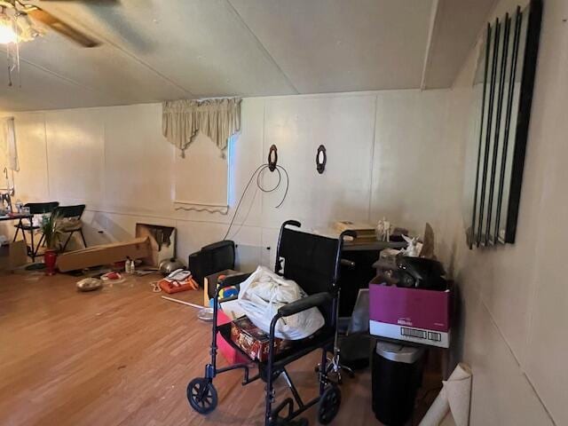 interior space with hardwood / wood-style floors and ceiling fan