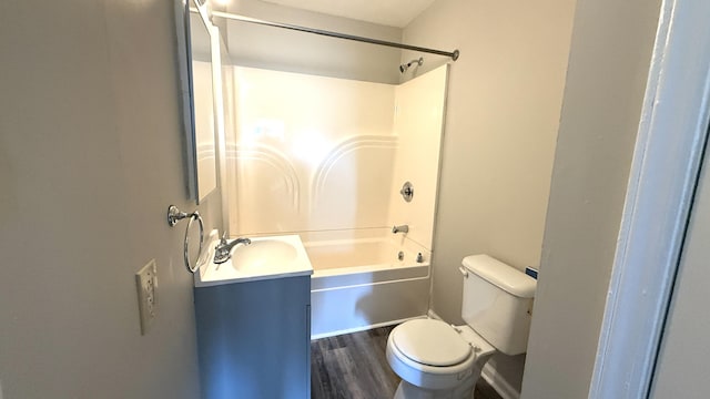 full bathroom with bathing tub / shower combination, toilet, vanity, and hardwood / wood-style flooring