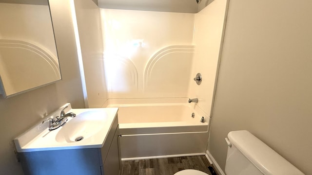 full bathroom featuring shower / tub combination, vanity, wood-type flooring, and toilet