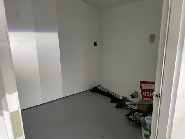 spare room with concrete flooring