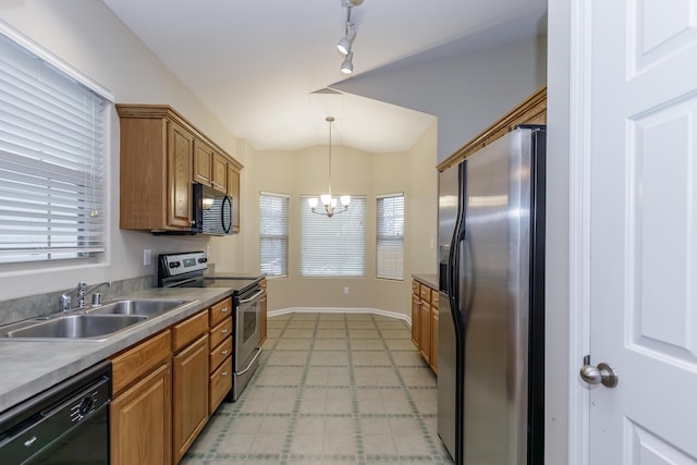 kitchen with a wealth of natural light, sink, black appliances, decorative light fixtures, and an inviting chandelier