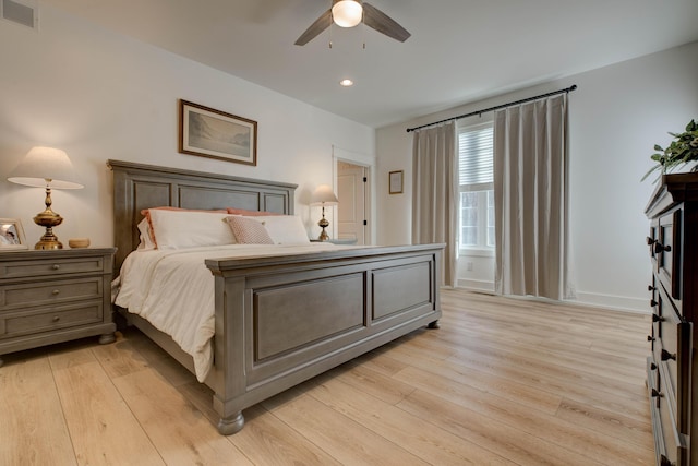 bedroom featuring ceiling fan and light hardwood / wood-style floors