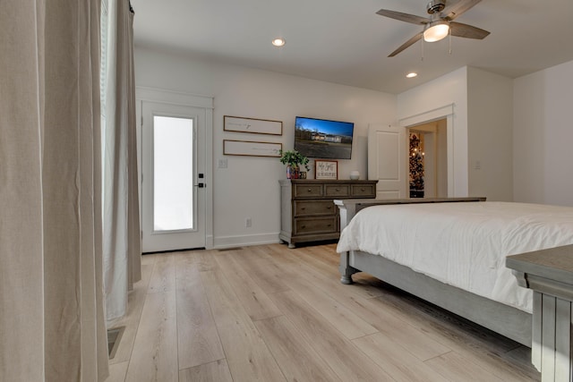 bedroom with ceiling fan and light hardwood / wood-style floors