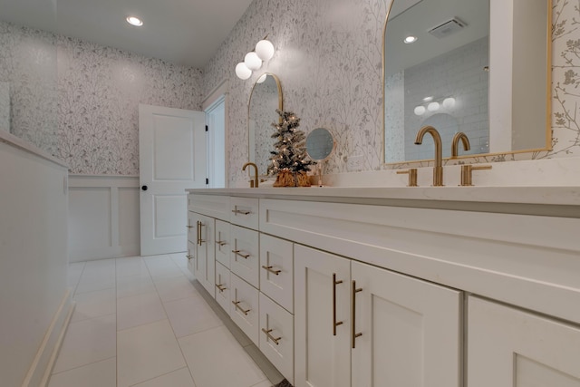 bathroom with tile patterned flooring and vanity