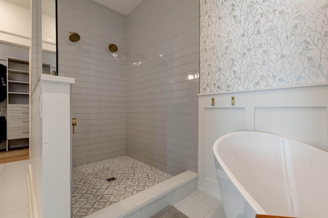 bathroom with tile patterned floors and shower with separate bathtub