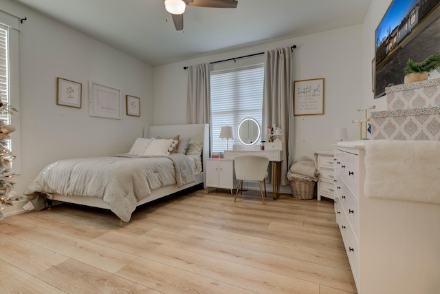 bedroom with ceiling fan and light wood-type flooring