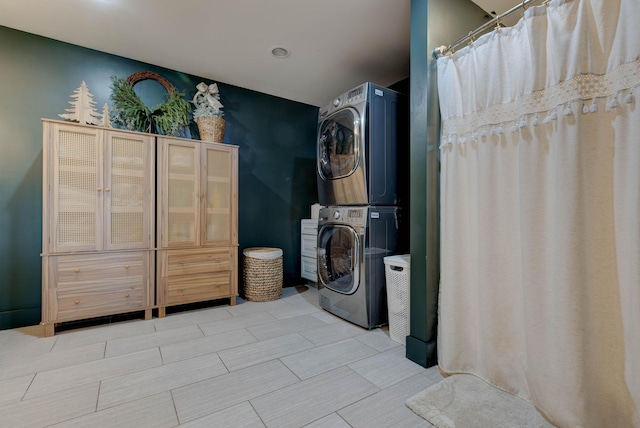 laundry room featuring stacked washer and dryer