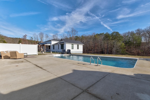 view of swimming pool with a patio area