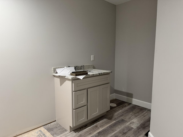 bathroom with hardwood / wood-style floors