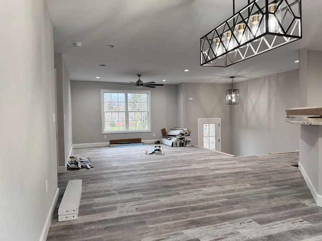 interior space featuring hardwood / wood-style flooring and ceiling fan