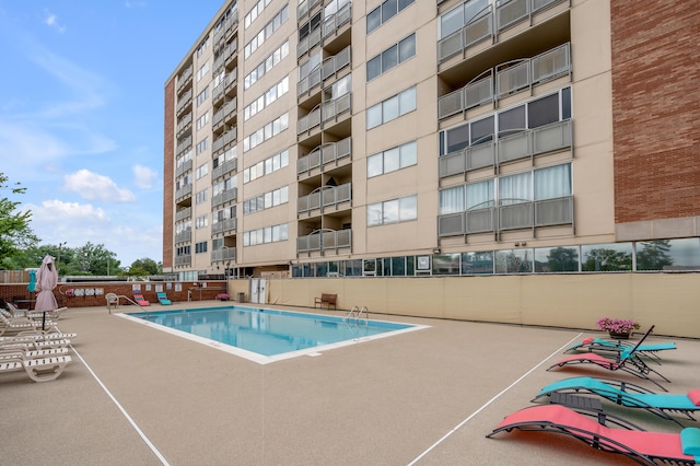 view of swimming pool with a patio