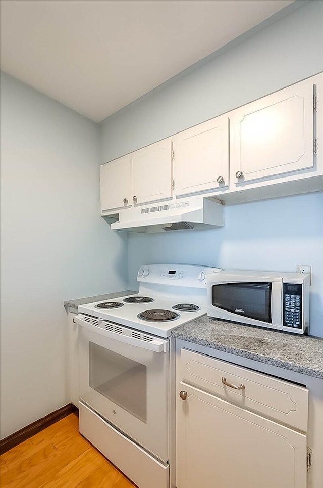 kitchen featuring light hardwood / wood-style floors, white cabinetry, and white appliances