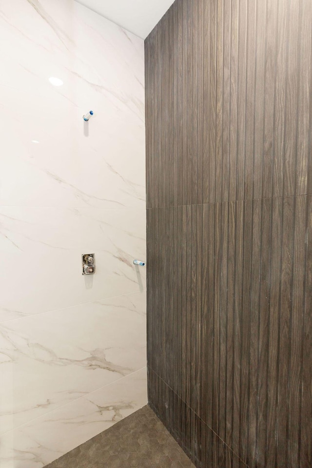 bathroom with a tile shower