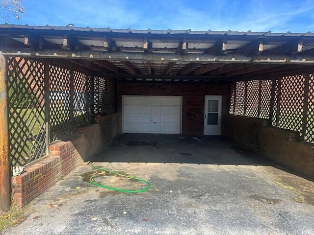 garage featuring a carport