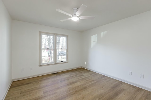 unfurnished room with ceiling fan and light hardwood / wood-style flooring