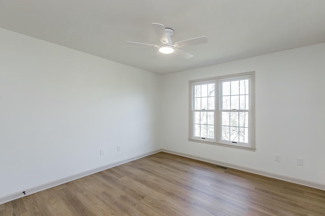 unfurnished room featuring ceiling fan and light hardwood / wood-style flooring