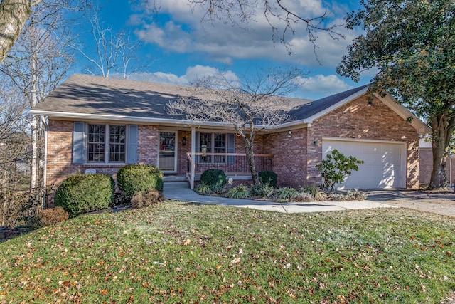 ranch-style home with covered porch, a garage, and a front lawn