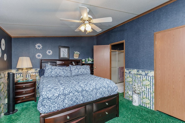 carpeted bedroom featuring ceiling fan and ornamental molding