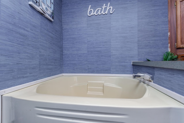 bathroom featuring a tub to relax in