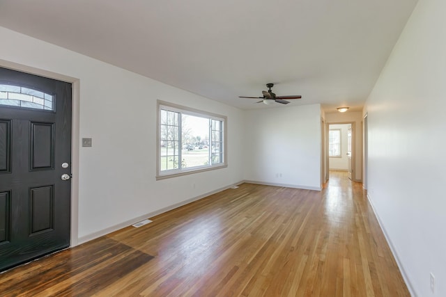 foyer entrance featuring ceiling fan and light hardwood / wood-style flooring