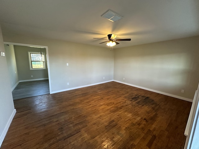 empty room featuring dark hardwood / wood-style floors and ceiling fan