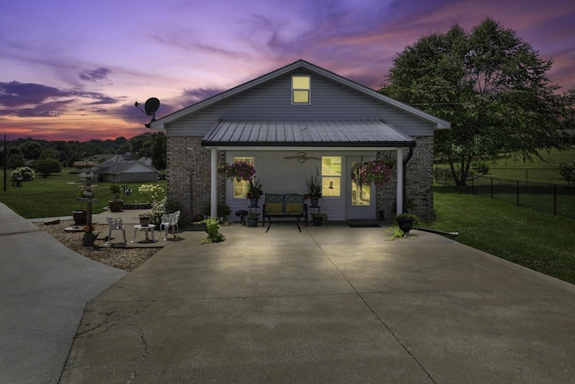 exterior space with a yard and covered porch