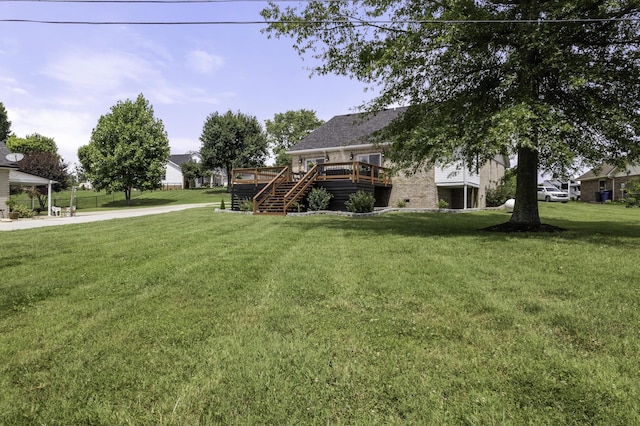 view of yard with a wooden deck