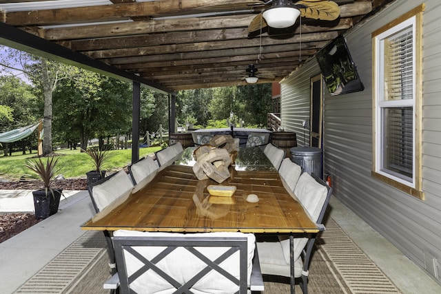 view of patio featuring ceiling fan