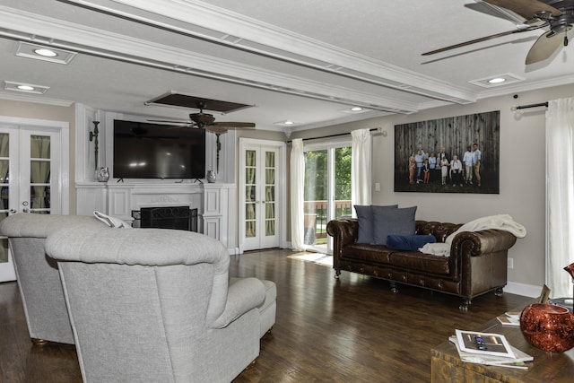 living room with a high end fireplace, french doors, crown molding, ceiling fan, and dark hardwood / wood-style flooring