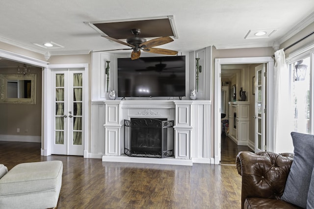 living room featuring ceiling fan, dark hardwood / wood-style flooring, french doors, and ornamental molding