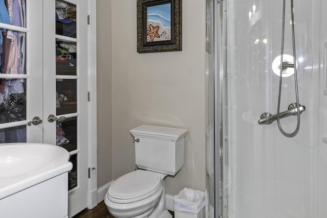 bathroom with toilet and walk in shower