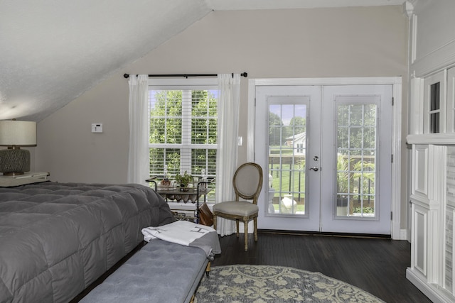 bedroom featuring french doors, lofted ceiling, multiple windows, and dark wood-type flooring