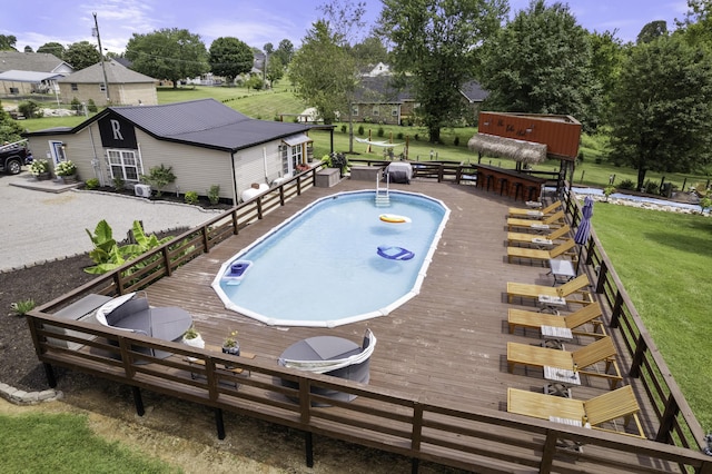 view of pool featuring a wooden deck