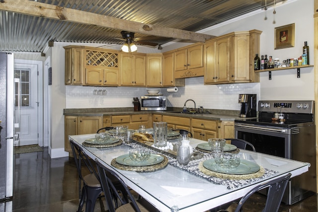 kitchen with appliances with stainless steel finishes, backsplash, ceiling fan, sink, and beam ceiling