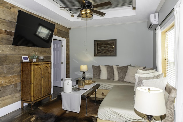 living room featuring wooden walls, a raised ceiling, a wall mounted AC, and ornamental molding