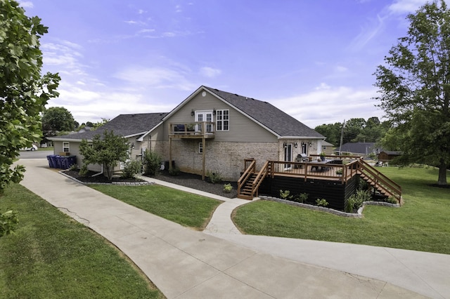 exterior space featuring a yard and a wooden deck