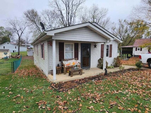 bungalow with a patio area and a front yard