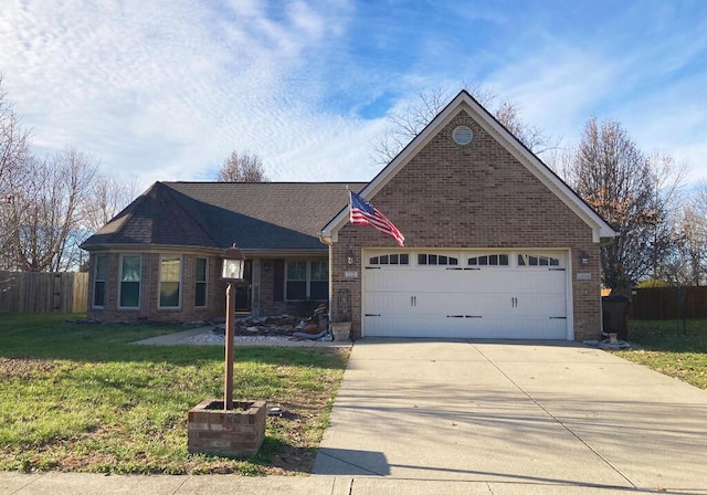 ranch-style home featuring a garage and a front yard