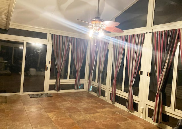 spare room with ceiling fan and crown molding