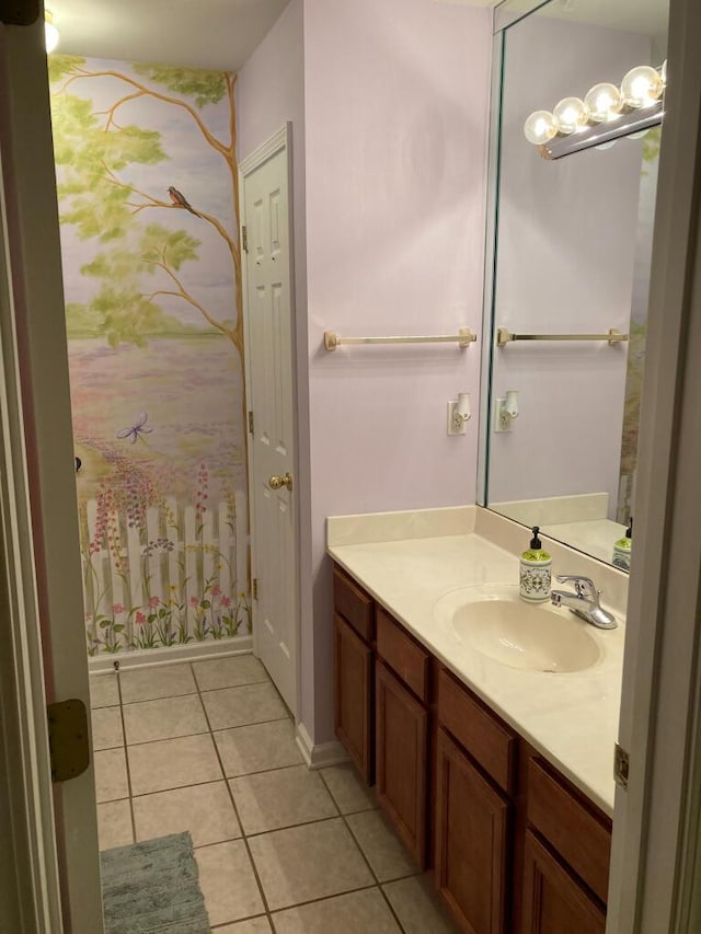 bathroom featuring tile patterned flooring and vanity