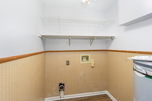 laundry room with laundry area, wainscoting, dark wood-style floors, washer hookup, and electric dryer hookup