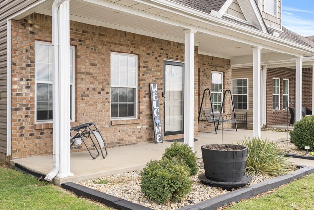 doorway to property featuring a porch