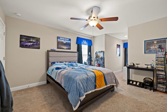 bedroom featuring carpet, ceiling fan, and baseboards