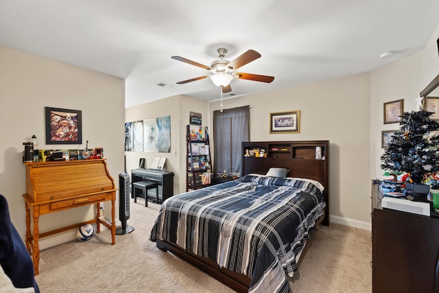 bedroom featuring light carpet, baseboards, visible vents, and a ceiling fan