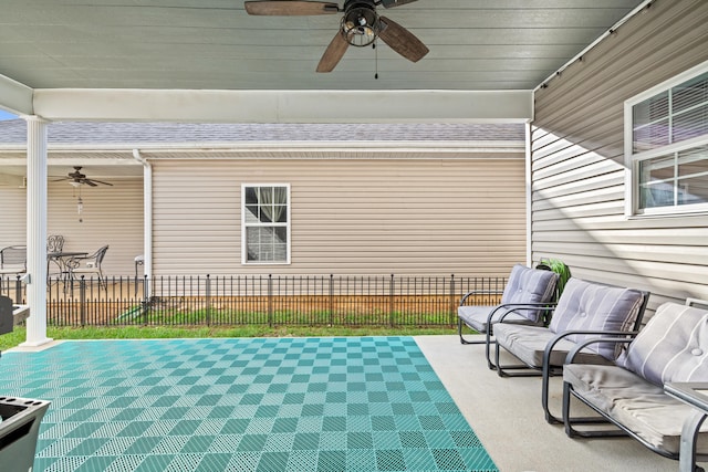 view of patio / terrace featuring ceiling fan and fence